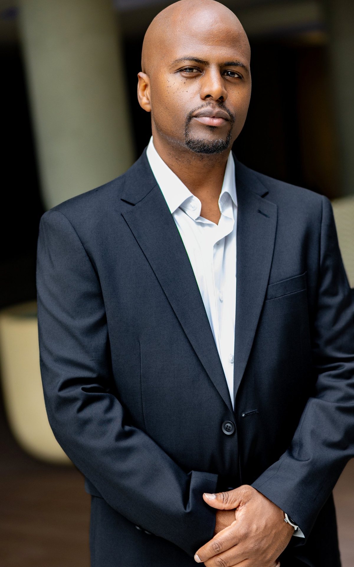 Lawrence R. Mike, business strategist, in a navy suit